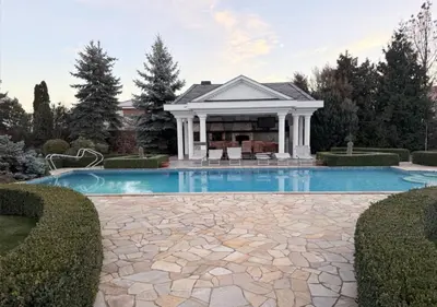 a house with a swimming pool in a yard at Luxury Villa