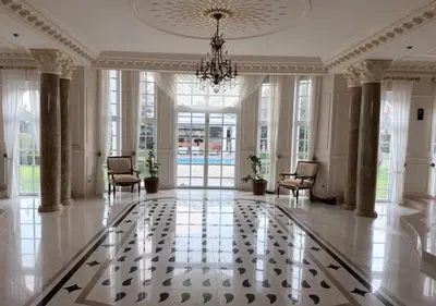 a large room with a chandelier and a lobby at Luxury Villa