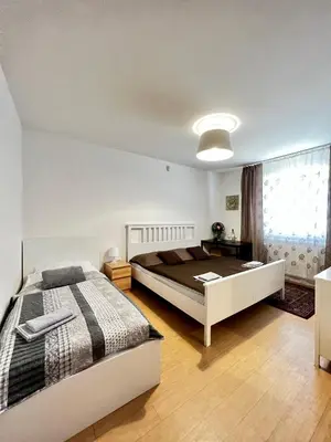 a bedroom with a large bed and a window at Penzion Sofi in Prague