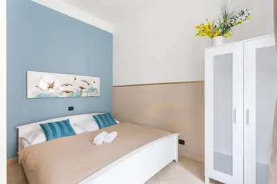 a bedroom with a bed with two towels on it at Legerova 33 Apartments in Prague