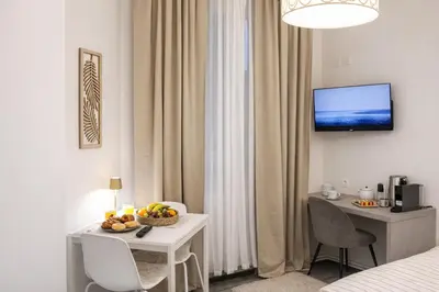 a hotel room with a table with a fruit bowl on it at D&D Apartment Moderní apartmán v centru Prahy in Prague