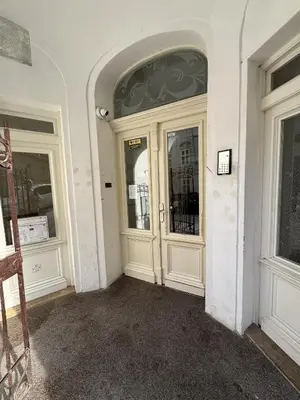 an entrance to a white building with two doors at D&D Apartment Moderní apartmán v centru Prahy in Prague