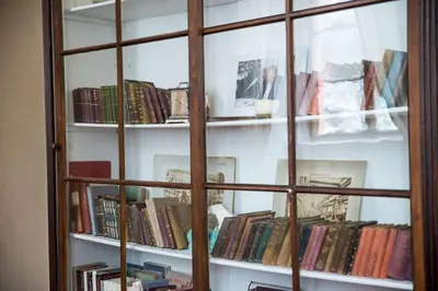 a book shelf filled with lots of books at Zámek Lobeč in Lobeč