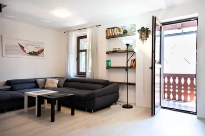 a living room with a couch and a table at U báby Šubrový in Kokořín
