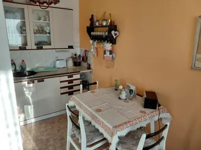 a kitchen with a table with chairs and a table and a kitchen at At the Star in Kladno