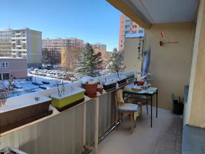 a balcony with a table and a view of a city at At the Star in Kladno