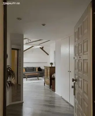 a living room with a couch and a door at Room for 2 in Central Prague 8 Apartment in Prague