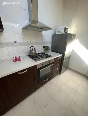 a kitchen with a stove and a refrigerator at Room for 2 in Central Prague 8 Apartment in Prague