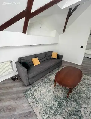 a living room with a couch and a table at Room for 2 in Central Prague 8 Apartment in Prague
