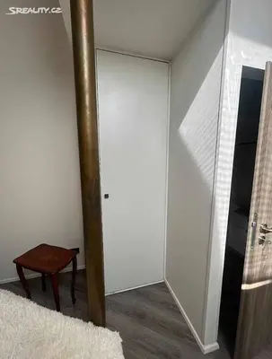 a room with a mirror and a table and a pole at Room for 2 in Central Prague 8 Apartment in Prague