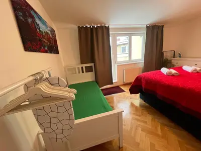 a bedroom with a bunk bed with a green mattress at Charming Apartment Klimentska in Prague