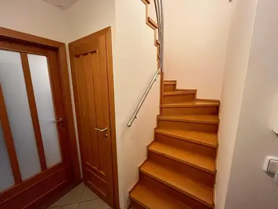 a bedroom with a large bed and a window at Charming Apartment Klimentska in Prague