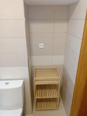 a small bathroom with a toilet and a shower at Historic Villa Apartments in Prague