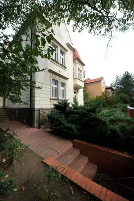 a house with a brick walkway in front of it at Historic Villa Apartments in Prague