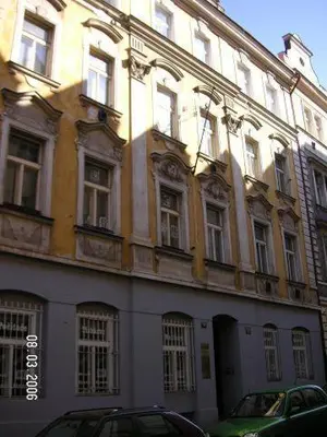 a large white building with a lot of windows at Hostel Bell in Prague