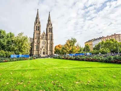a church with a grass field in front of it at Studio Balbin by Interhome in Prague