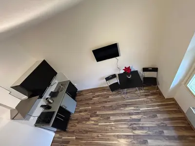 a living room with a room with a table and chairs at Bacpackers paradise in Prague City center in Prague