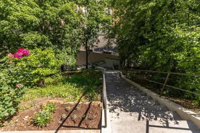 an overhead view of a garden with pink roses at Bacpackers paradise in Prague City center in Prague