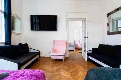 a living room with two couches and a tv at Victory Noble Estate in Prague