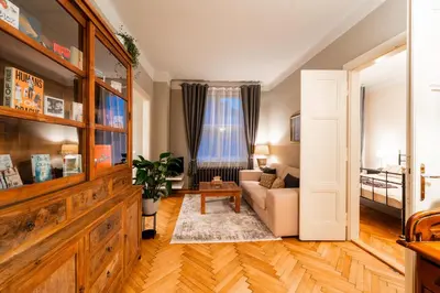 a living room with a couch and a window at Charming Apartment in Haštalská in Prague