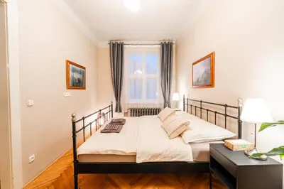 a bedroom with a bed and a window at Charming Apartment in Haštalská in Prague