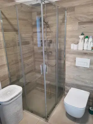 a bathroom with a shower and a toilet at Large Apartment with terrace and big garden in Prague