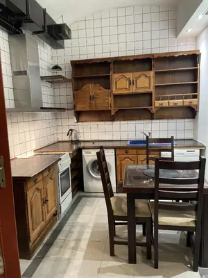 a kitchen with a table and chairs in it at Apartment Otakar in Nymburk