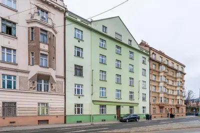 a row of colorful buildings on a street at Rentero Smíchov Riverside & Station Residence in Prague
