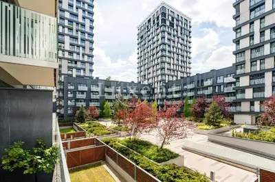 a courtyard in a city with tall buildings at Garden Residence - Byt 412 in Prague
