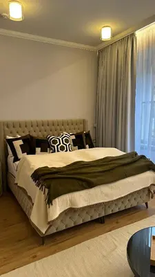 a bedroom with a large bed in a room at Bohemia Boutique Hotel Prague in Prague