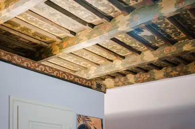 a ceiling in a room with paintings on it at Bohemia Boutique Hotel Prague in Prague