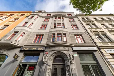 an old building in the city of munich at Stylový penthouse u pražského parku a centra in Prague