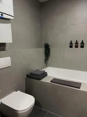 a bathroom with a toilet and a bath tub at Adel in Prague in Prague