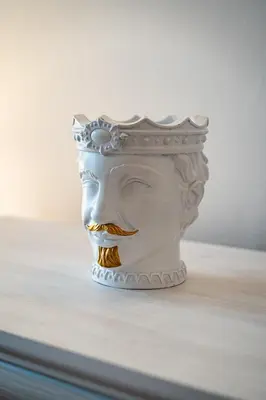 a statue of a head wearing a crown at Royal Center Palace in Prague