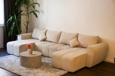 a living room with a television on a wall at Stylish Apartment by Charles Bridge in Prague