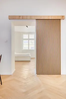 a room with a wooden floor and a window at Modern City Apartment with Balcony by Rentez in Prague