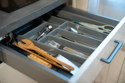 a drawer filled with utensils in a kitchen at ZEN APT Prague 1 City Center Modern Studio in Prague