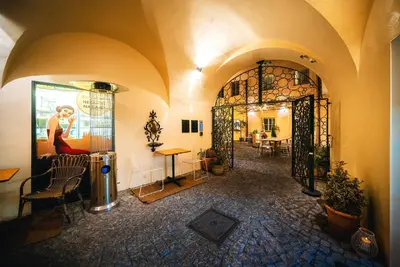 a room with an entrance to a building with a door at Old Royal Post Boutique Hotel & Premium Suites in Prague
