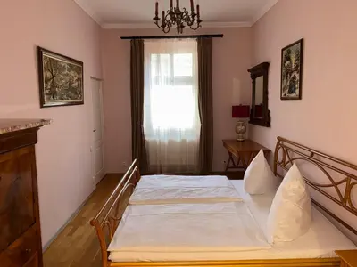 a bedroom with a bed and a window at Vintage Charm in the Heart of Prague in Prague