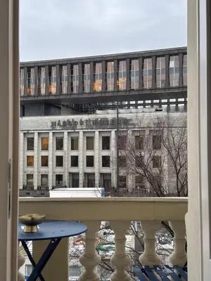 a view of a building from a balcony at Heritage Haven Mezzanine Apartment with Balcony in Prague