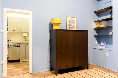 a kitchen with a wooden cabinet with a yellow object on top at Old Town - 2BR - Living Room - Sleeps 8 - Metro 1 minute - Newly renovated in Prague