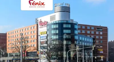 a large glass building in a city with buildings at Apart & Studio metro Vysočanská in Prague