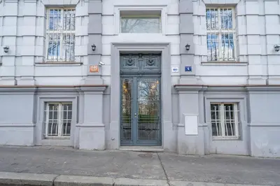 a white building with a door on the side of it at HOMELY I Central 38m2 APT I ELEVATOR I Self Check-In in Prague