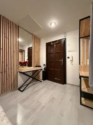 an empty room with a table and a door at Cozy Prague Navrátilová in Prague