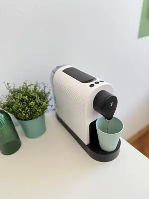 a toaster sitting on a table next to a plant at Old Town Green Room with private bathroom in Prague