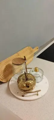 a counter with two glass bowls and a wooden spoon at Quiet Apartment Near Prosek Metro, Line C in Prague