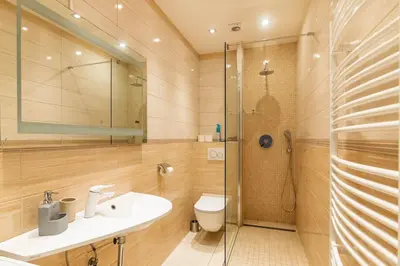 a bathroom with a toilet and a shower and a sink at Prague Centre Apartments in Prague