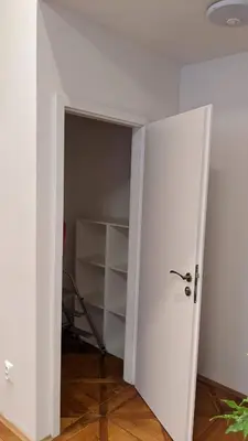 an open door to a room with a closet at Prague Centre Apartments in Prague