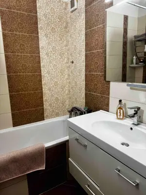 a bathroom with a white sink and a bath tub at 2-luzkovy pokoj Praha-13 metro HURKA in Prague