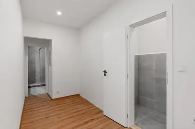 a bathroom with a shower and a sink at Skyline Terrace Flat in Prague